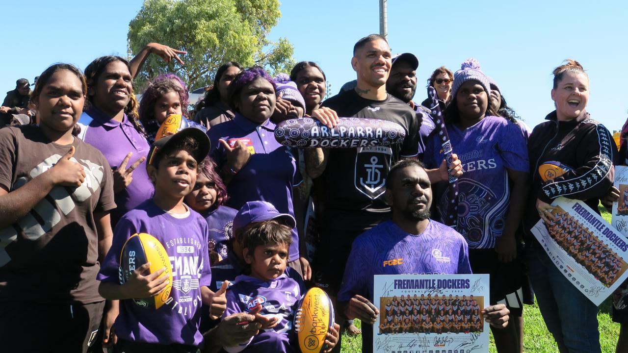 The Arlparra Dockers with Fremantle Docker Michael Walters. Fremantle Dockers will play the Melbourne Demons at Traeger Park, Alice Springs, on Sunday, June 2, 2024.