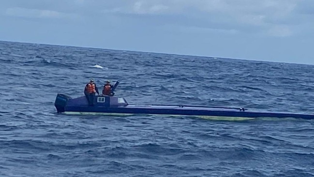 The submarines sit very low in the water to try to avoid detection.