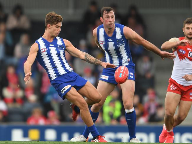 Jy Simpkin of the Kangaroos kicks the ball during the 2020 Marsh Community Series AFL match between the North Melbourne Kangaroos and Sydney Swans at Kingston. Picture: STEVE BELL/GETTY IMAGES