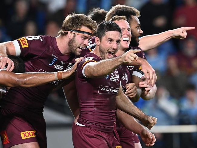 GOLD COAST, AUSTRALIA - JULY 14:  Ben Hunt of the Maroons celebrates with team mates after scoring his second try during game three of the 2021 State of Origin Series between the New South Wales Blues and the Queensland Maroons at Cbus Super Stadium on July 14, 2021 in Gold Coast, Australia. (Photo by Bradley Kanaris/Getty Images)