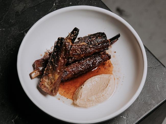 Lamb ribs with sesame whey caramel, mountain pepper and lime from Agnes Restaurant. Picture: David Chatfield