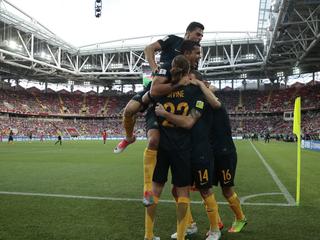 Australia's James Troisi celebrates with his teammates after scoring his side's first goal during the Confederations Cup, Group B soccer match between Chile and Australia, at the Spartak Stadium in Moscow, Sunday, June 25, 2017. (AP Photo/Pavel Golovkin)