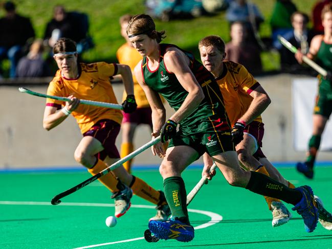 Under 18 Hockey Final at the Tasmanian Hockey Centre. Tasmania vs Queensland. Oscar Pritchard attacks for Tasmania. Picture: Linda Higginson
