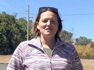 TOO CLOSE FOR COMFORT: Tina Moore returned from holidays to find fires raging just metres from her Lakes Creek home. Picture: Jann Houley