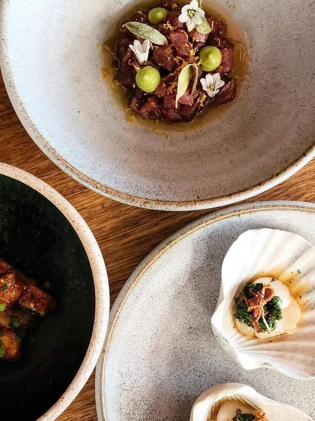 An assortment of Aloft's smaller dishes of first and second courses on the set menu, including tuna, avocado and toasted sesame with white soy and meyer lemon ponzu, scallop sashimi with nasturtium nam Jim jaew, crispy hot and sour eggplant. Picture: Supplied