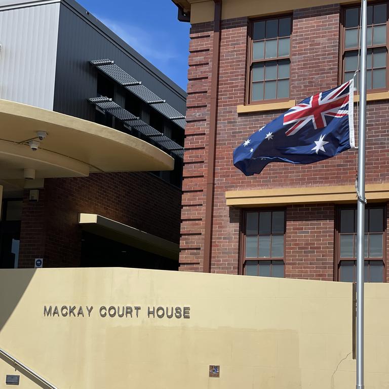 An Australian flag at Mackay courthouse flying at half mast in honour of the two young police officers. Photo: Janessa Ekert