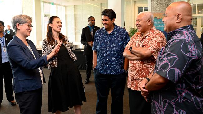 Foreign minister Penny Wong (L), New Zealand prime minister Jacinda Ardern (2L), Palau president Surangel Whipps Jr (C), Fiji prime minister Frank Bainimarama (2R) and David Panuelo, President of Federated States of Micronesia (R) at the Pacific Islands Forum in Suva in July. Picture: AFP.