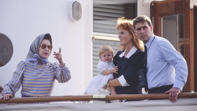 Queen Elizabeth II, Prince Andrew, Duke of York, and Sarah, the Duchess of York in 1989. (Photo by Julian Parker/UK Press via Getty Images)