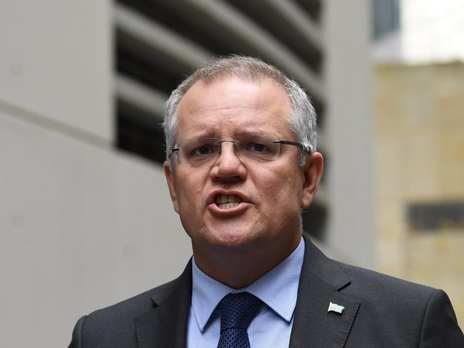 Federal Treasurer Scott Morrison says Mr Abbott’s comments are ‘background noise’. Picture: AAP