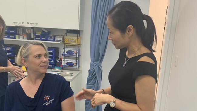 Sydney Street Medical receptionist Belinda O'Reilly talks to GP Dr Shuren Taylor about her flu vaccination. Picture: Melanie Whiting