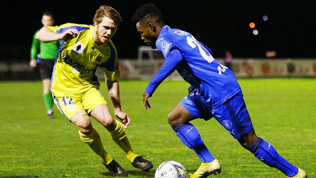 Avondale FC’s Elvis Kamsoba tries to skip past Devonport Strikers’ Beau Blizzard. Picture: Getty Images.