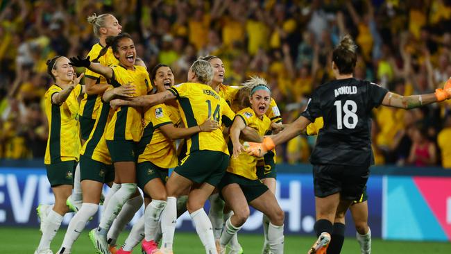 Matildas players celebrate winning the FIFA Womens World Cup Quarter final match between against France at Brisbane Stadium. Picture Lachie Millard