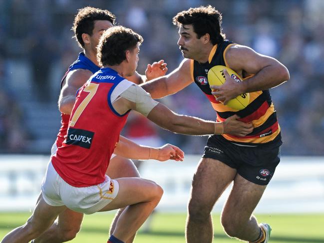 ADELAIDE, AUSTRALIA - MAY 12:    Darcy Fogarty of the Crows fends off  Jarrod Berry of the Lions  during the round nine AFL match between Adelaide Crows and Brisbane Lions at Adelaide Oval, on May 12, 2024, in Adelaide, Australia. (Photo by Mark Brake/Getty Images)