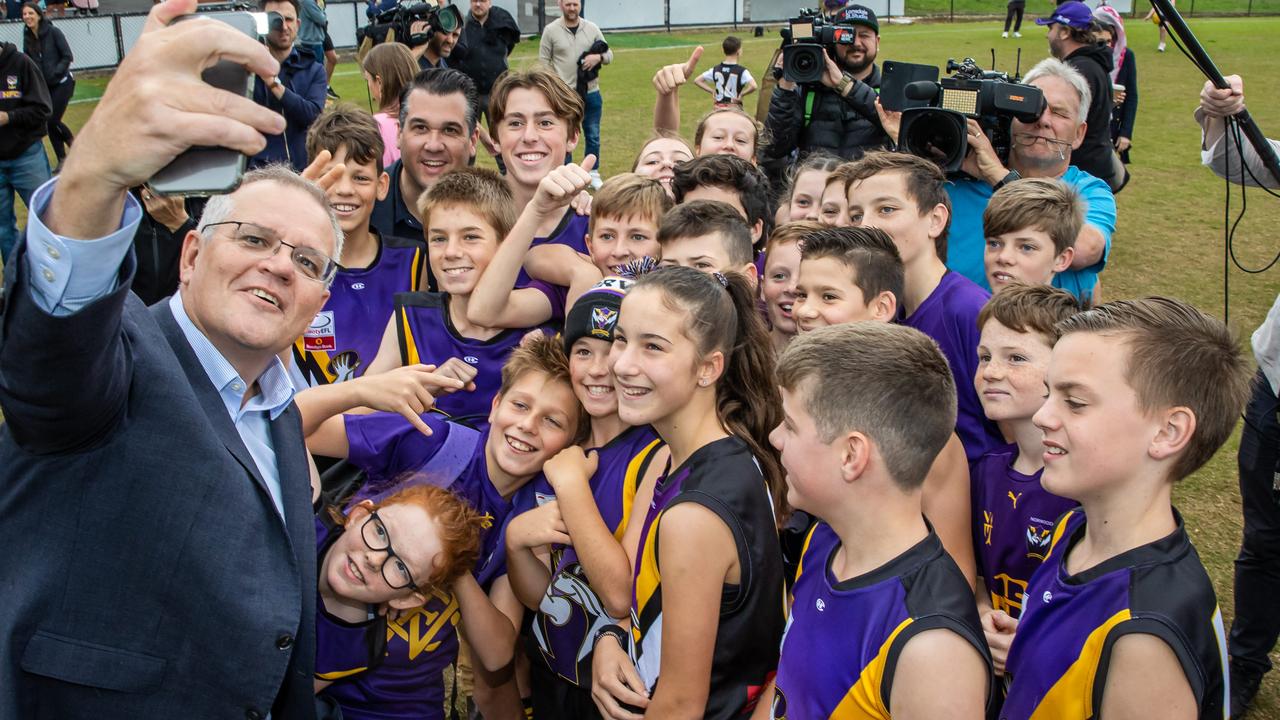 Prime Minister Scott Morrison takes a selfie with the kids from Norwood Sporting Club. Picture: Jason Edwards