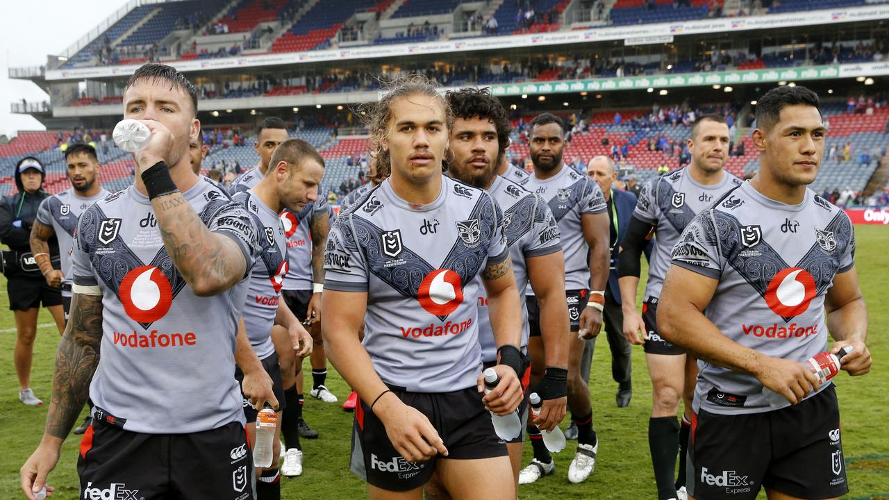 Warriors players leave the field after the Round One NRL match against the Newcastle Knights at McDonald Jones Stadium in Newcastle.