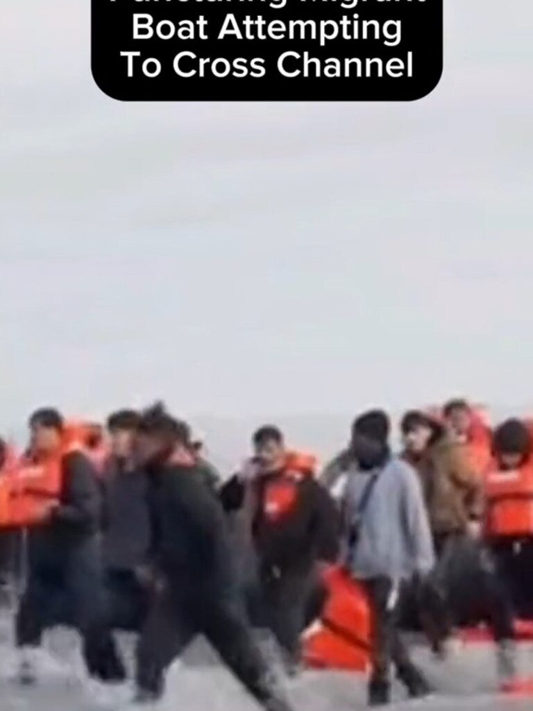 A French officer was filmed slashing an inflatable dinghy filled with migrants attempting to cross the English Channel. Picture TikTok