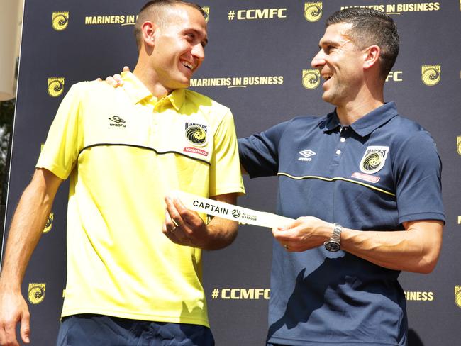 Alan Baro is presented with the captain’s armband by outgoing captain Nick Montgomery (AAP image / Mark Scott)