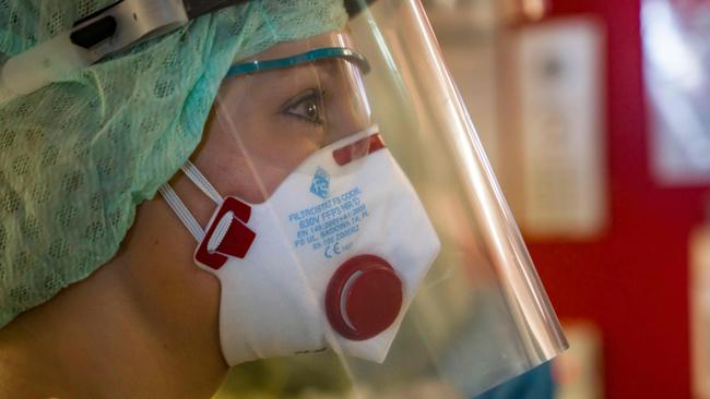 A nurse in Germany wears a full length face shield similar to those now being recommended for ICU staff at the Royal Adelaide Hospital. Picture: AFP