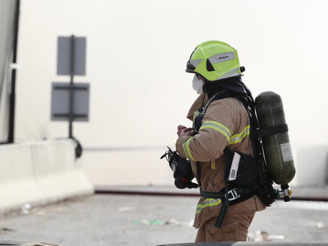 A firefighter at a large industrial fire in Melbourne. Picture: David Crosling