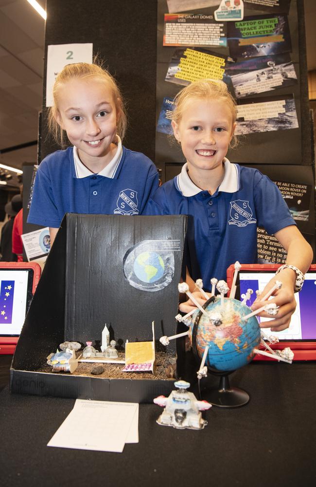 Warwick West State School students Nola Kent (left) and Maggie Stevens with their space collector junk and moon rover display as part of Kids in Space Queensland finals and showcase at Edmund Rice Cultural Centre St Mary's College, Friday, June 7, 2024. Picture: Kevin Farmer