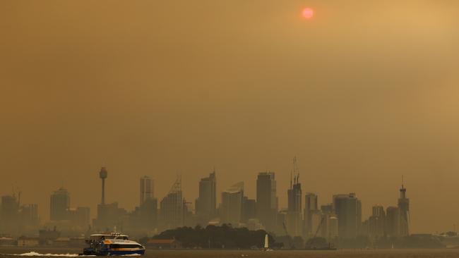 Smoke haze from bushfires in New South Wales blankets the CBD in Sydney this week. Picture: Steven Saphore