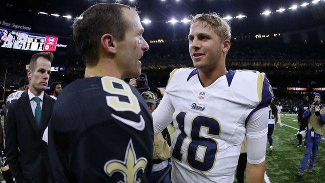 Drew Brees #9 of the New Orleans Saints and Jared Goff #16 of the Los Angeles Rams greet after a game.