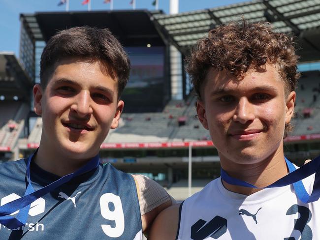 MELBOURNE, AUSTRALIA - SEPTEMBER 28: Josh Lindsay of Team Heppell and Beau Addinsall of Team Sloane pose with their best player medalsduring the Marsh AFL National Futures Boys match between Team Heppell and Team Sloane at Melbourne Cricket Ground, on September 28, 2024, in Melbourne, Australia. (Photo by Daniel Pockett/AFL Photos/via Getty Images)