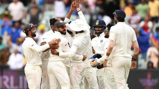 ADELAIDE, AUSTRALIA - DECEMBER 10: India celebrate getting the final wicket and winning the test match during day five of the First Test match in the series between Australia and India at Adelaide Oval on December 10, 2018 in Adelaide, Australia. (Photo by Quinn Rooney/Getty Images)