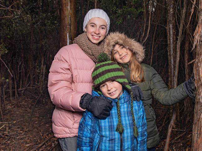Eva Redrup aged 12, Taj Rudrup aged 8 from Woodbridge and Emi Alexander aged 9 from Central Coast NSW were rugged up ready for a walk on Mount Wellington / kunanyi on Sunday 14th July 2024.Picture: Linda Higginson