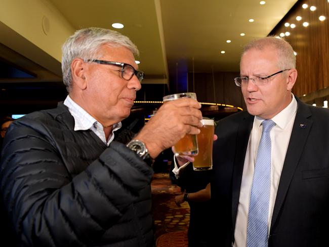 Prime Minister Scott Morrison and Warren Mundine cheers to the end of the campaign at Nowra Bowling Club on Friday night.