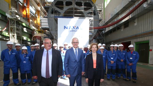 Herve Guillou, chief executive, of Naval Group, then prime minister Malcolm Turnbull and French Armed Forces Minister Florence Parly at the Naval Group submarine boatyard at Cherbourg in France. Picture: Kym Smith