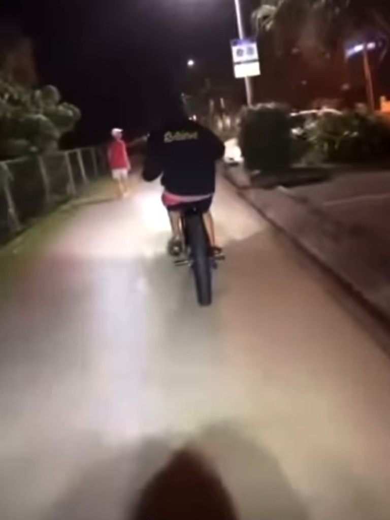 A video posted to a southern Gold Coast Facebook community page has shown the moment two boys conspire to throw liquid on to a walker. Photo: Facebook