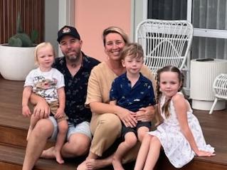 The Young family are selling their Kiama Downs house at auction to help ease the financial burden of dad Jason's hospital care. The family is pictured with mum Emma, kids Georgie, 7, Lenny, 6, and Tully, 2. NSW real estate.