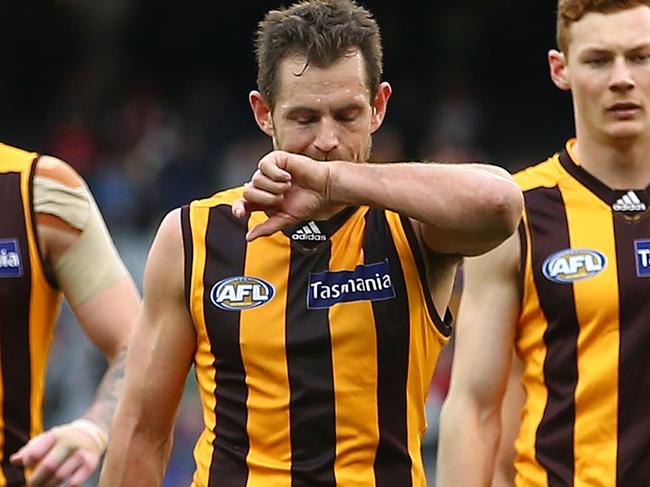 MELBOURNE, AUSTRALIA - AUGUST 06: Luke Hodge of the Hawks leads his side from the field after losing the round 20 AFL match between the Melbourne Demons and the Hawthorn Hawks at Melbourne Cricket Ground on August 6, 2016 in Melbourne, Australia. (Photo by Scott Barbour/Getty Images)