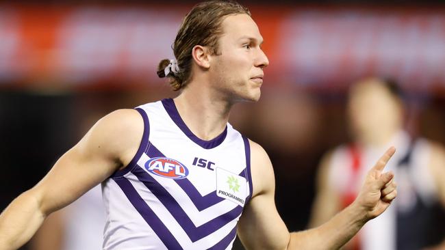 MELBOURNE, AUSTRALIA - AUGUST 11: Ed Langdon of the Dockers celebrates a goal during the 2019 AFL round 21 match between the St Kilda Saints and the Fremantle Dockers at Marvel Stadium on August 11, 2019 in Melbourne, Australia. (Photo by Michael Willson/AFL Photos via Getty Images)