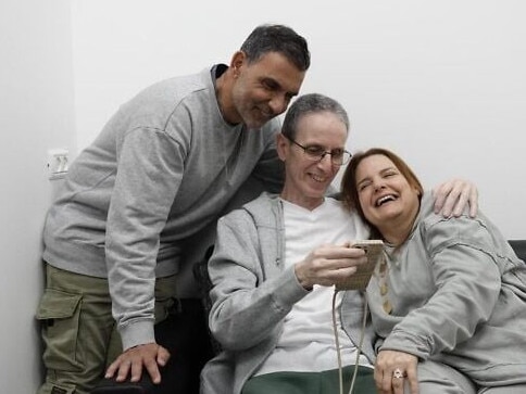 e Ohad Ben Ami reunites with his wife Raz and brother Kobi at an army facility near the Gaza border after 491 days in Hamas captivity, as they make a video call to his three daughters, February 8, 2025. Picture: IDF.