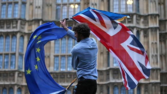 The Union Jack and European Union flag take a twirl outside the the Houses of Parliament in London. Picture: AFP