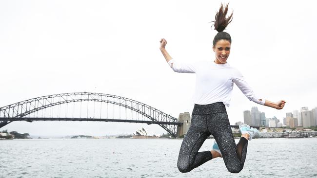 Tara Rushton leaping into her fitness routine at Blues Point Reserve. Picture: Tim Pascoe