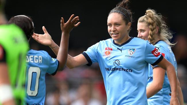 Kyah Simon celebrates scoring a goal with teammates during the W-League match between Sydney and Canberra this year. Pic: Brett Hemmings/Getty Images