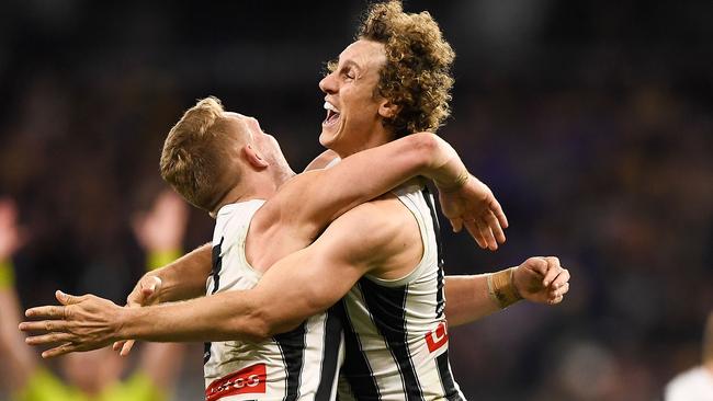 Adam Treloar and Chris Mayne celebrate Collingwood’s win. Picture: Getty Images