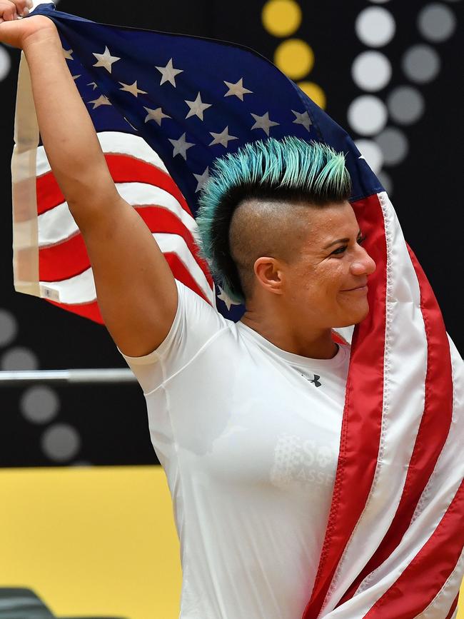 Sebastiana Lopez of the US celebrates her gold medal in the women's midweight powerlifting. Picture: Saeed Khan/AFP