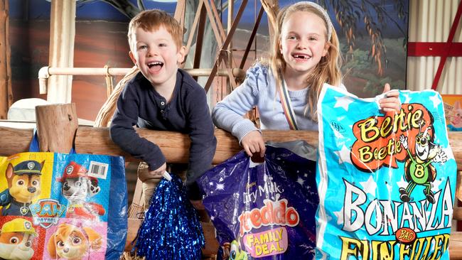 Eddie Harnas, 7(R), and her brother Bowie,3, getting an early look at some of this yearÃs show bags. 12 August 2024. Picture Dean Martin