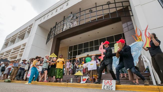 Anti-fracking protesters dressed as gas company executives lose in a tug-of-war during a demonstration at the steps of the Supreme Court. Picture: Pema Tamang Pakhrin