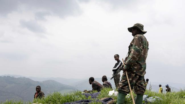 A M23 soldier stands at the coltan mining pits in Rubaya, Congo on March 5. Picture: Camille Laffont / AFP