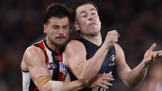 MELBOURNE, AUSTRALIA - AUGUST 25:  Jack Sinclair of the Saints bumps Matthew Owies of the Blues during the round 24 AFL match between Carlton Blues and St Kilda Saints at Marvel Stadium, on August 25, 2024, in Melbourne, Australia. (Photo by Darrian Traynor/Getty Images)