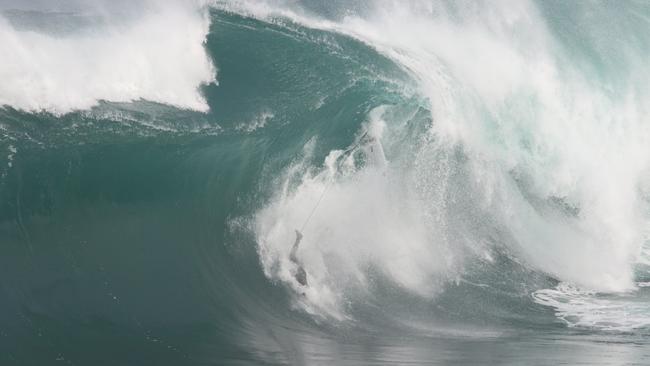 Australian big wave surfer Dylan Longbottom and the wipeout that put him in hospital at a South Australian reef break. Picture: Andrew Brooks