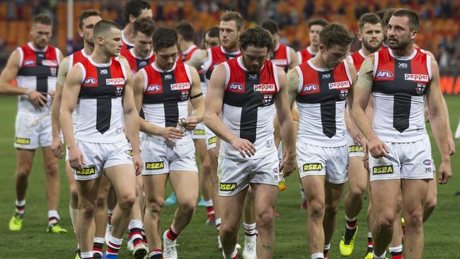 Dejected St Kilda players walk off after losing to GWS.