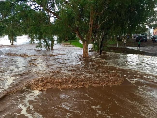 The Todd river creeping up near the Undoolya Rd crossing. PHOTO: Amber Chambers