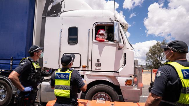 Santa trucker Dean Elliott of Melton is quizzed on the Hume. Picture: Simon Dallinger