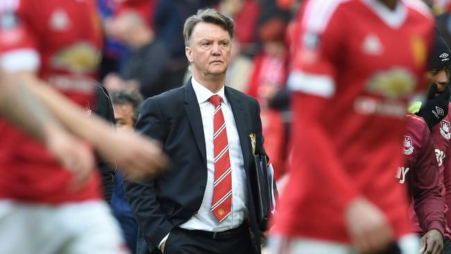 Manchester United's Dutch manager Louis van Gaal walks off at half-time in the FA Cup quarter final football match between Manchester United and West Ham United at Old Trafford in Manchester, north west England, on March 13, 2016. / AFP PHOTO / PAUL ELLIS / RESTRICTED TO EDITORIAL USE. No use with unauthorized audio, video, data, fixture lists, club/league logos or 'live' services. Online in-match use limited to 75 images, no video emulation. No use in betting, games or single club/league/player publications. /